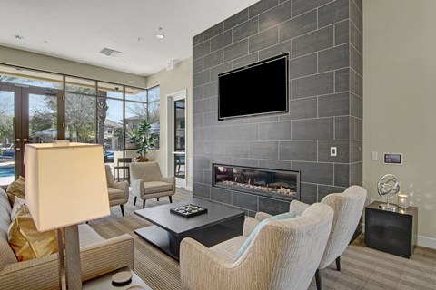 a living room with a fireplace and a television